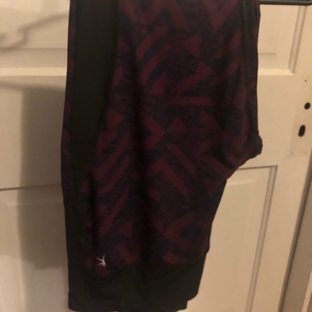 Danskin Now Size Large. Purple and black w/ sheer calf area. Super cute!